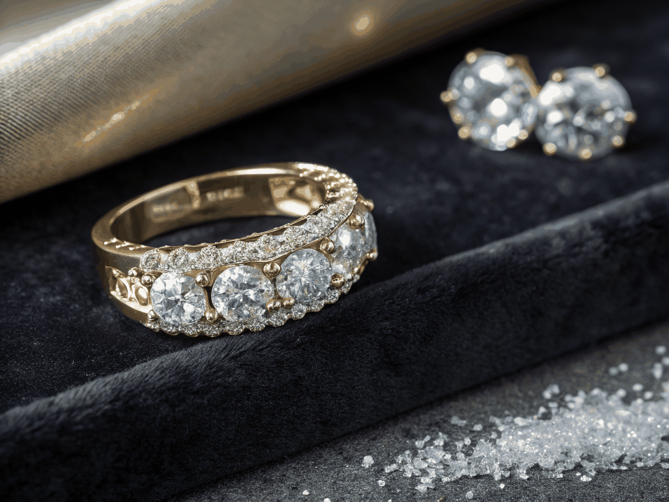 Three stacked premium engagement rings showcasing different settings